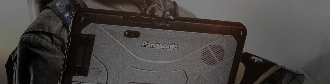 Field service worker in uniform holding Panasonic Toughbook 55